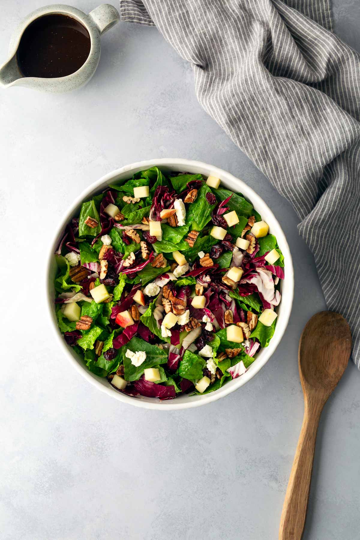 Fresh romaine and radicchio salad with apples, pecans, cranberries, and feta before adding roasted squash.